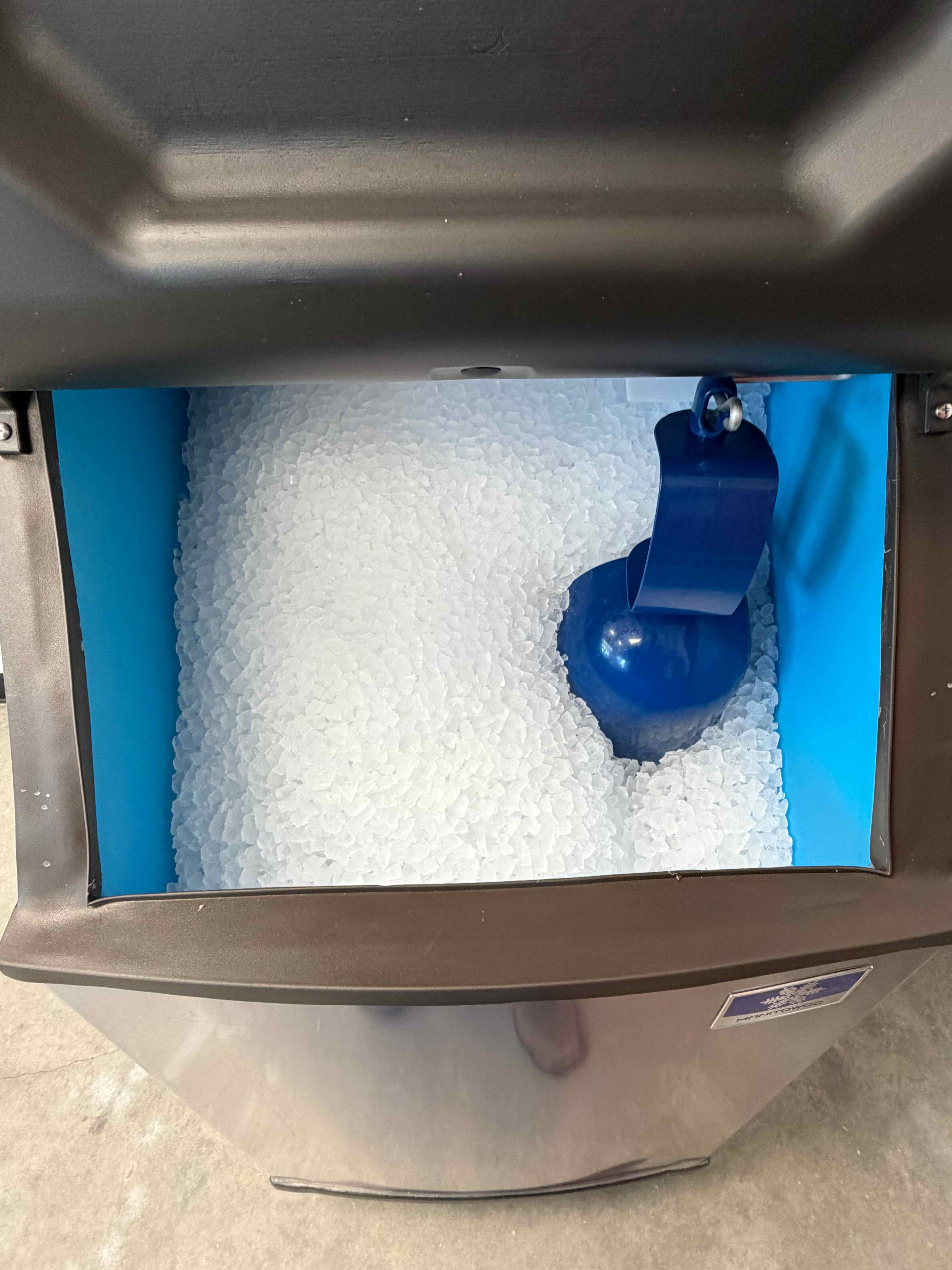 Hilke's blue scoop in a Manitowoc ice machine bin